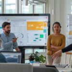 a dynamic office scene features a diverse group of professionals engaged in a collaborative brainstorming session, surrounded by modern digital resources and inspirational wall art, embodying the spirit of continuous learning and career growth in workplace engagement strategies.